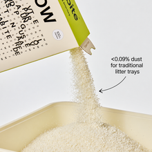 Snow cassava cat litter pouring into a traditional tray, with dust measured below 0.09%