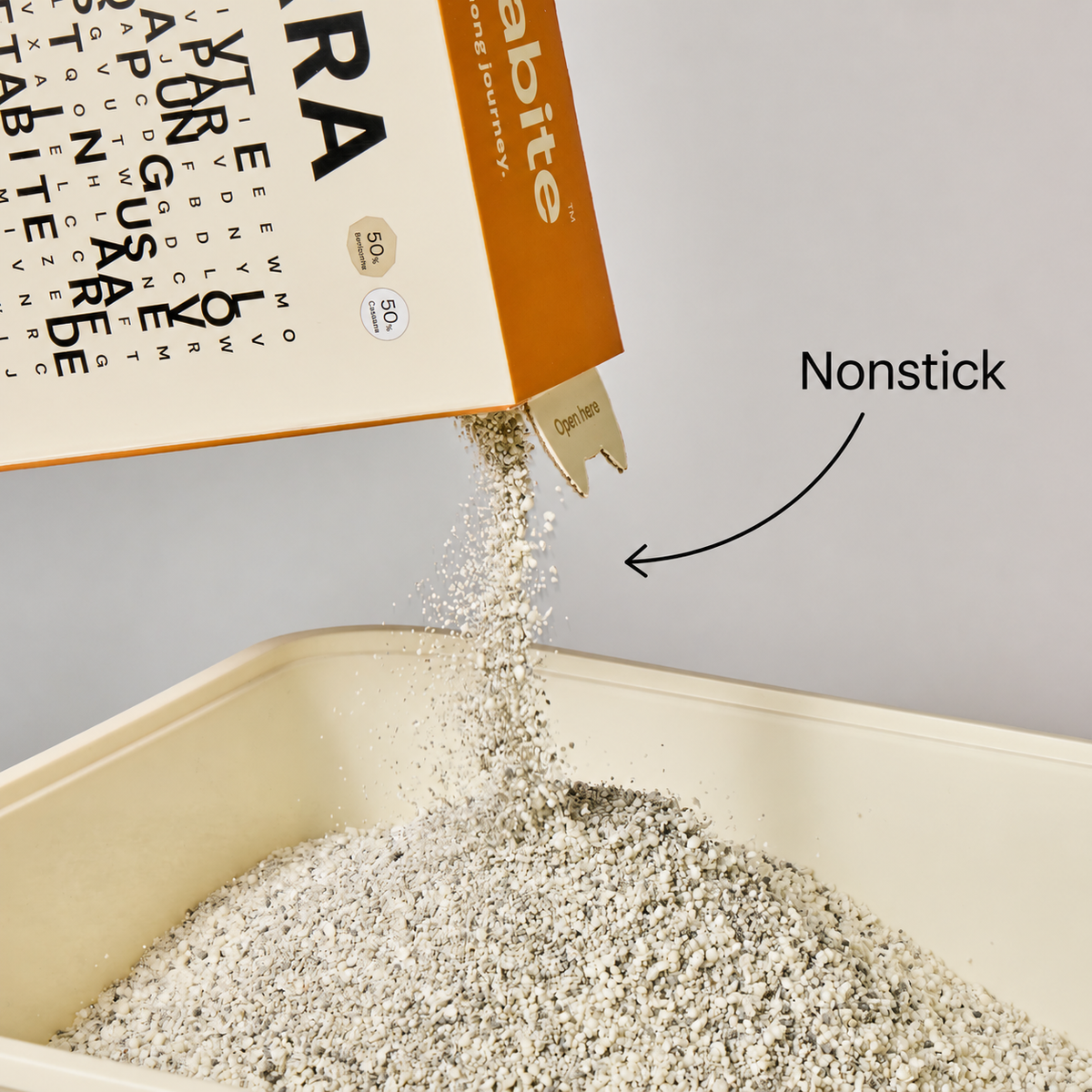 Terra cat litter pouring into a tray, showing its nonstick formula (Terra)